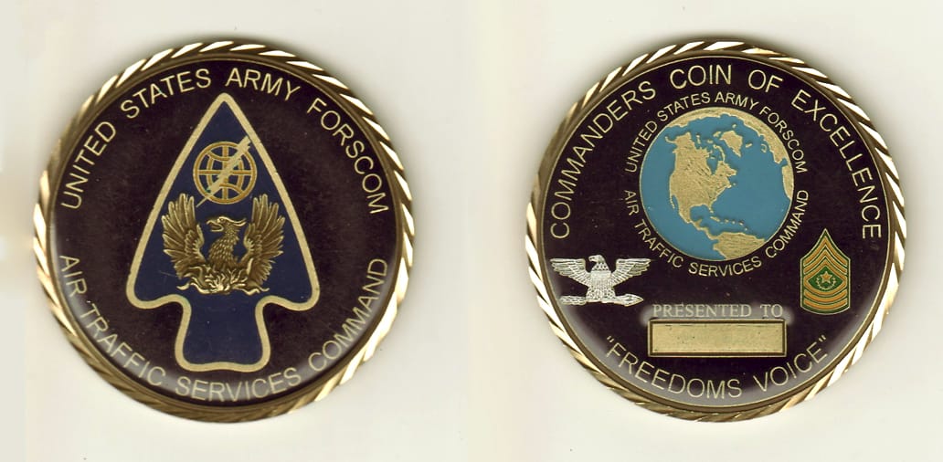 Round shaped, brass colored coin, 2-1/4 inches in diameter.