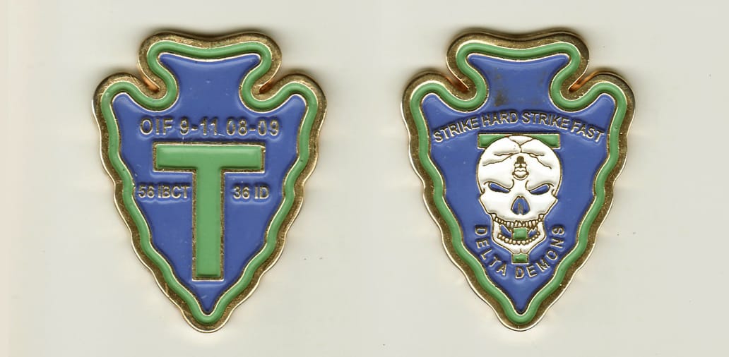 Arrowhead  shaped, gold colored coin, 2 inches high x 1 1/2  inches wide