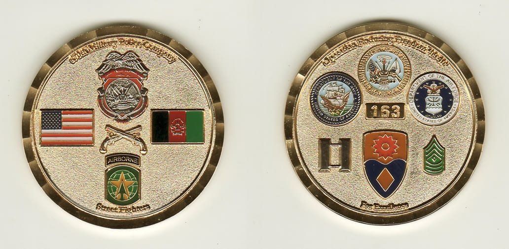 Round shaped, gold colored coin, 2 inches in diameter.