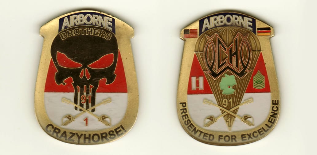 Closed horseshoe shaped,  brass colored coin, 2-1/4 inches high x 1-3/4 inches wide