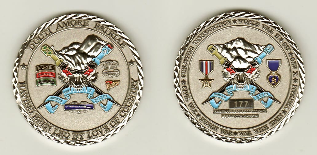 Round shaped, silver colored coin, 2 inches in diameter.