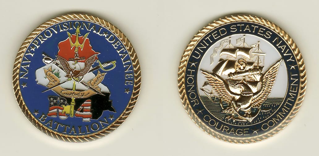 Round shaped, gold colored coin, 1-3/4 inches in diameter.