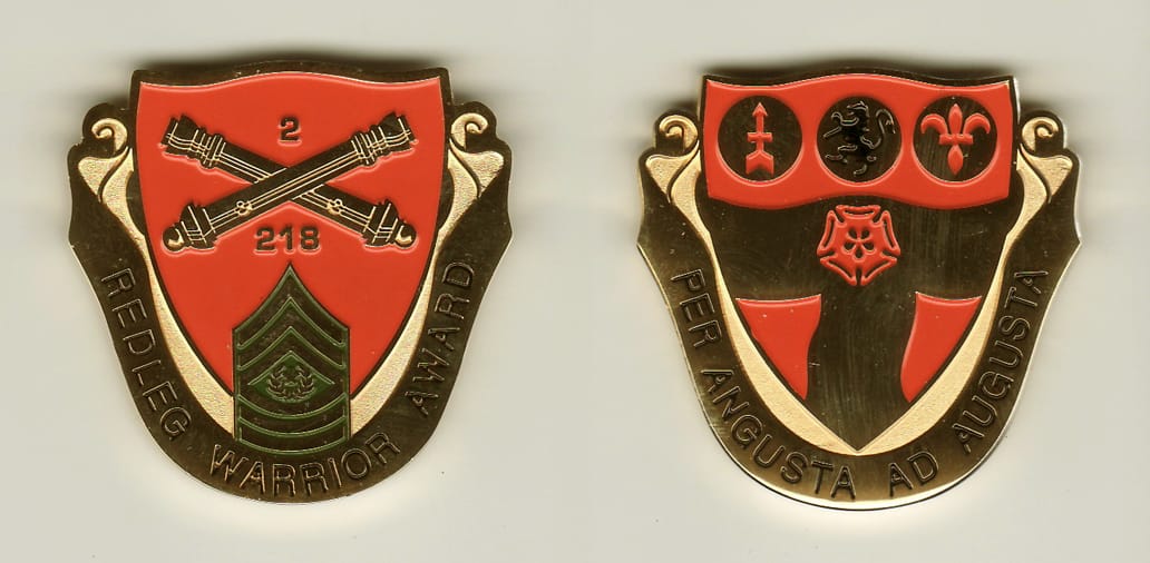 Shield shaped,  with banner mounted beneath and up sides, gold colored coin, 1-3/4 inches high x 1-3/4 inches wide