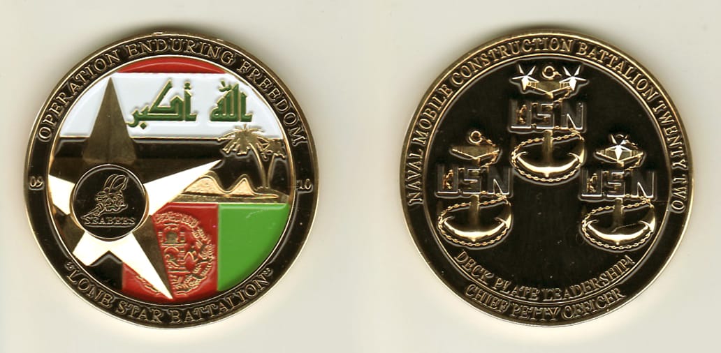 Round shaped, gold colored coin, 1-9/16 inches in diameter.