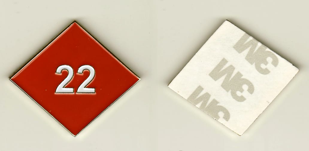 Diamond shaped, gold colored sticker coin, 2 inches wide x 2 inches high.