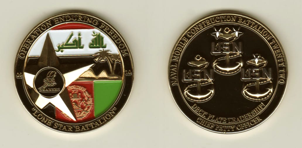 Round shaped, gold colored coin, 1-9/16 inches in diameter.