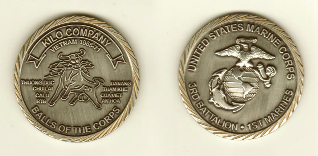 Round shaped, pewter colored coin, 1-5/8 inches in diameter.