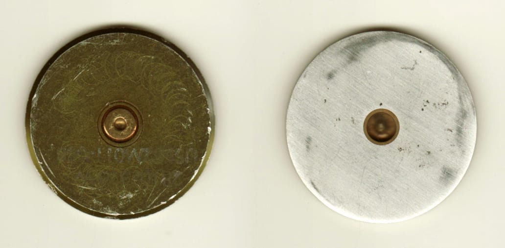 Round shaped, brass colored coin, 1-5/8 inches in diameter.