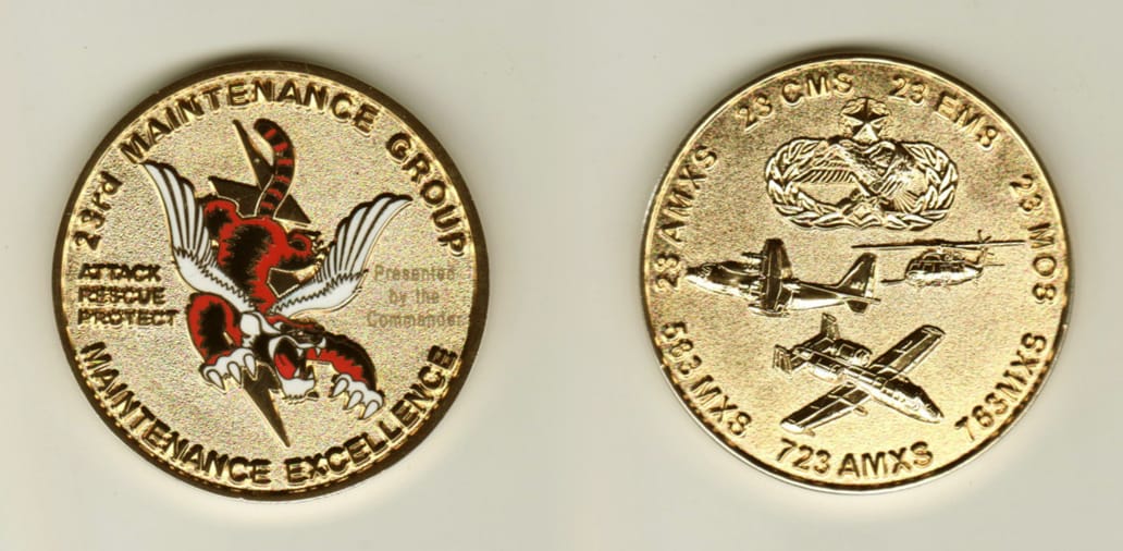 Round shaped, gold colored coin, 1-3/4 inches in diameter.