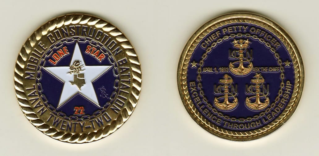 Round shaped, gold colored coin, 1-1/2 inches in diameter.