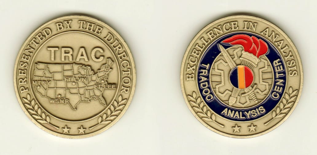 Round shaped, brass colored coin, 1-5/8 inches in diameter.