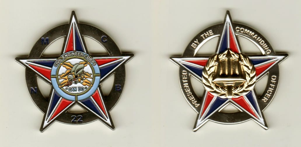 Round shaped, silver colored coin with Star Points extending, 1-3/4 inches in diameter.