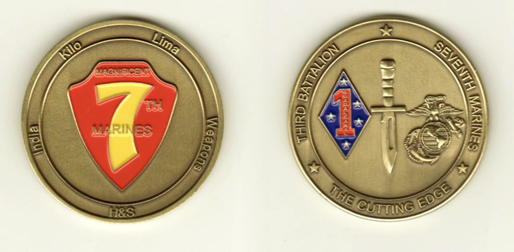 Round shaped, brass colored coin, 1-3/4 inches in diameter.