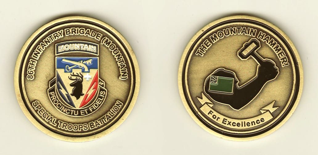 Round shaped, brass colored coin, 1-5/8 inches in diameter.