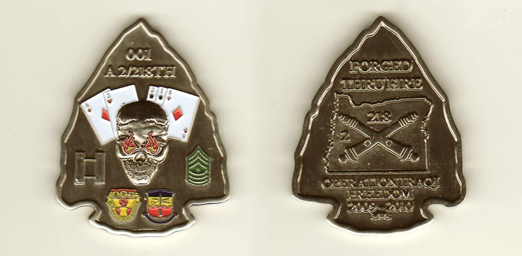 Arrowhead shaped, pewter colored coin, 1-1/4inches wide x 1-1/2 inches high.