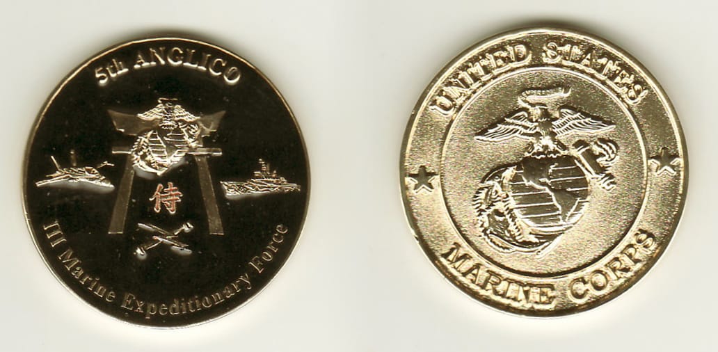 Round shaped, brass colored coin, 1-1/2 inches in diameter.