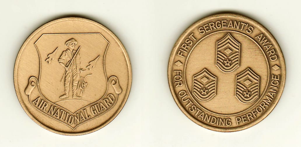 Round shaped, brass colored coin, 1-1/2 inches in diameter.