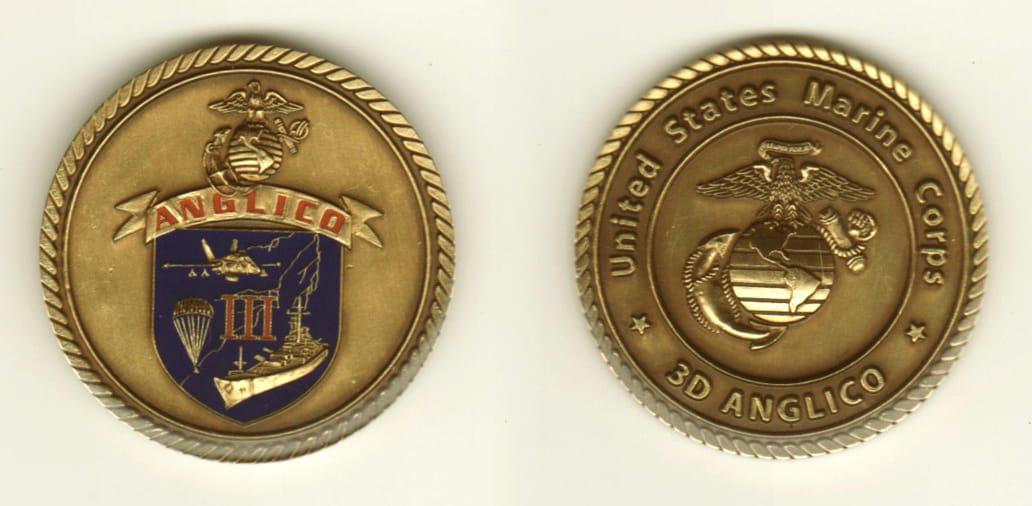 Round shaped, brass colored coin, 1-1/2 inches in diameter.