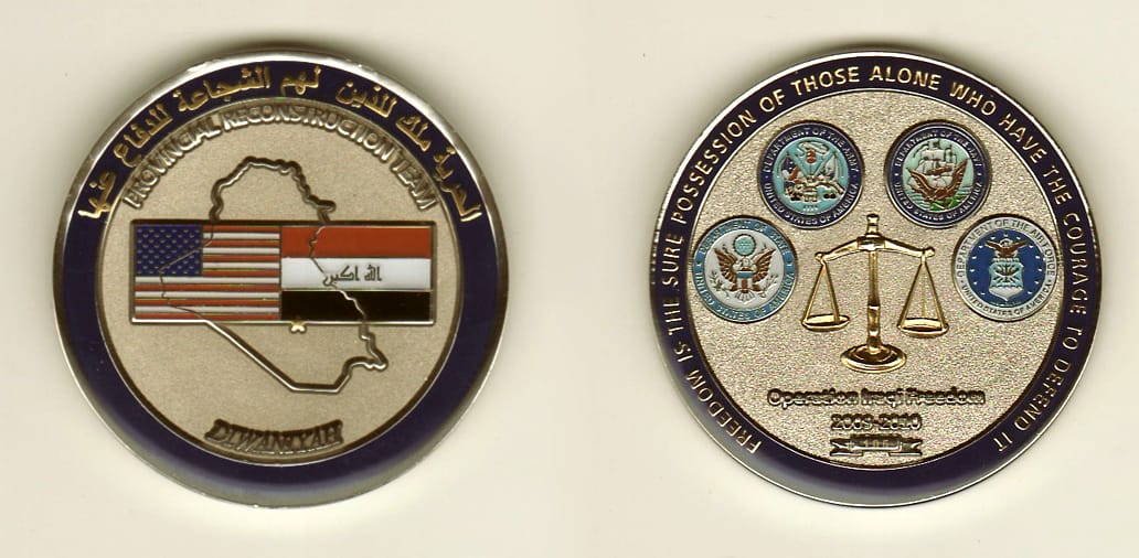 Round shaped, silver colored coin, 1-1/2 inches in diameter.