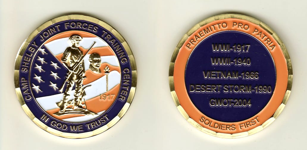 Round shaped, gold colored coin, 2 inches in diameter.