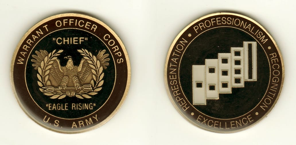 Round shaped, brass colored coin, 2 inches in diameter.