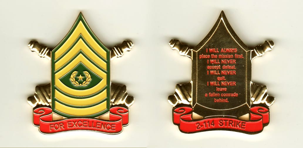 CSM chevron shaped with banner mounted beneath and crossed cannons extending, gold colored coin,1-1/2 inches wide x 2 in...