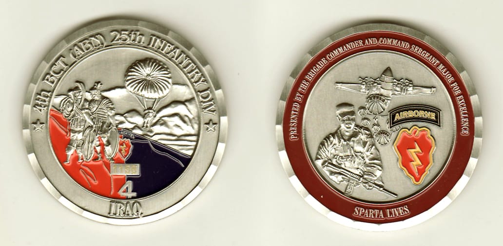 Round shaped, pewter colored coin, 2 inches in diameter.