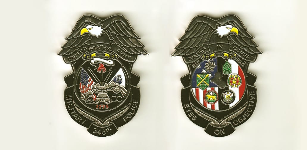 MP Badge shaped with banner mounted beneath and eagle mounted above, silver colored coin,1-7/8 inches wide x 2-1/2 inche...