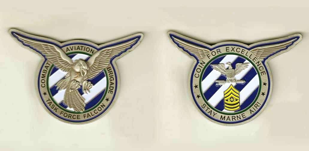 Round shaped with spread eagle wings extending, pewter colored coin, 4 inches wide x 3 inches high.