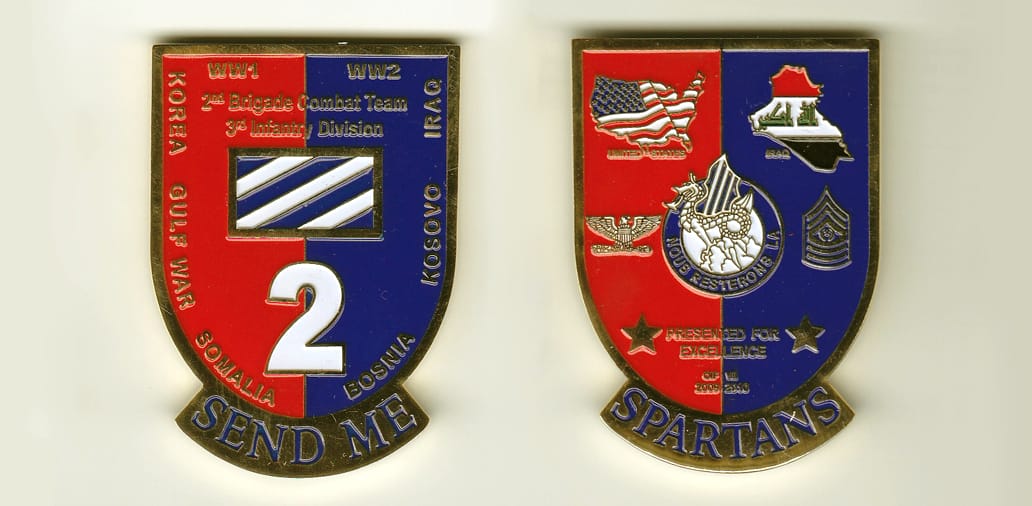 Shield shaped, gold colored coin, 1-5/8 inches wide x 2-1/4 inches high.