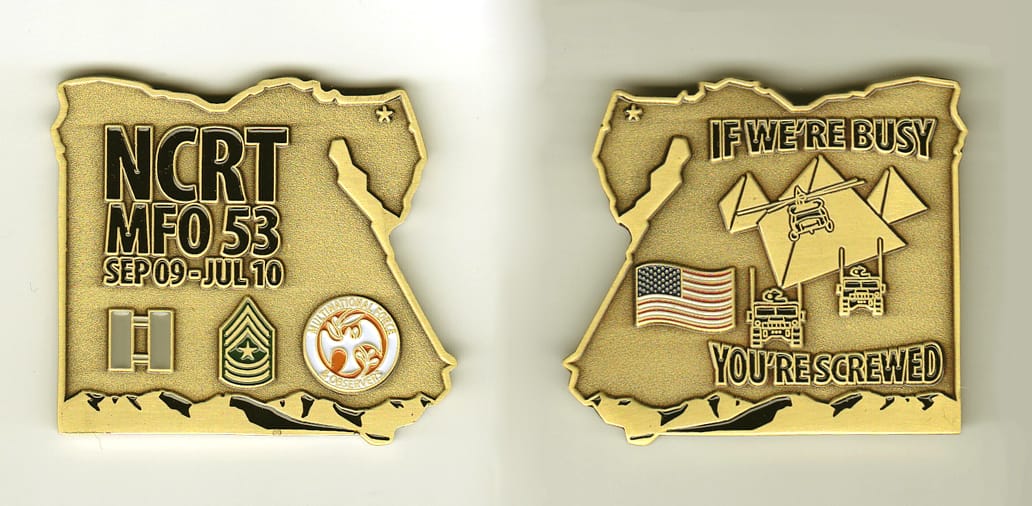 Egypt  shaped, brass colored coin, 1-3/4 inches wide x 1-3/4 inches high.