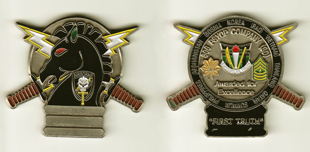 Light bulb shaped with two dagger handles and 2 lightning bolts extended, pewter colored coin, 2-1/4 inches wide x 2-1/2...