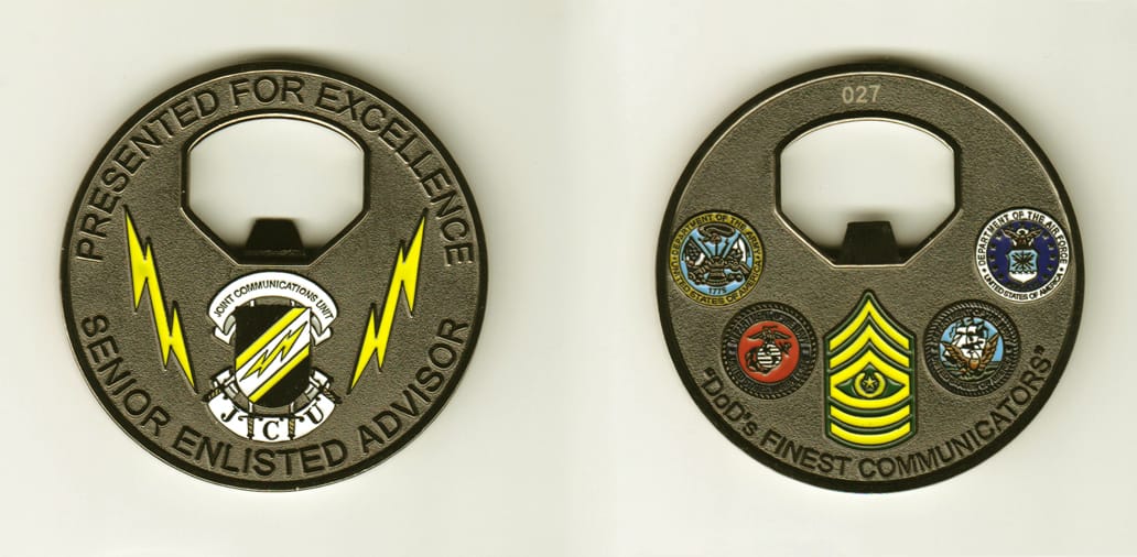 Round shaped, gunmetal black colored coin, 2-1/2 inches in diameter.