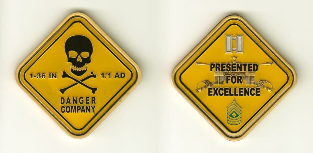 Diamond shaped, brass colored coin, 2 inches wide x 2 inches high.