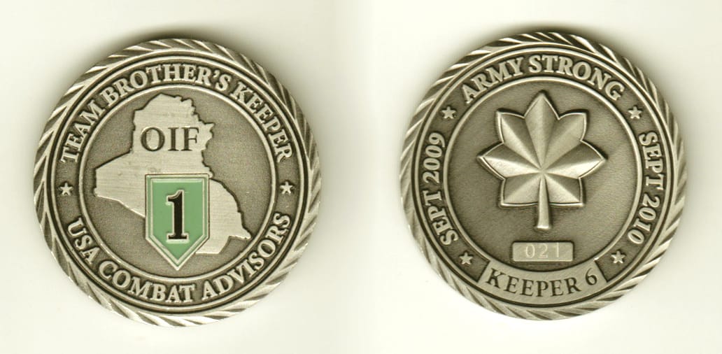 Round shaped, pewter colored coin, 2 inches in diameter.