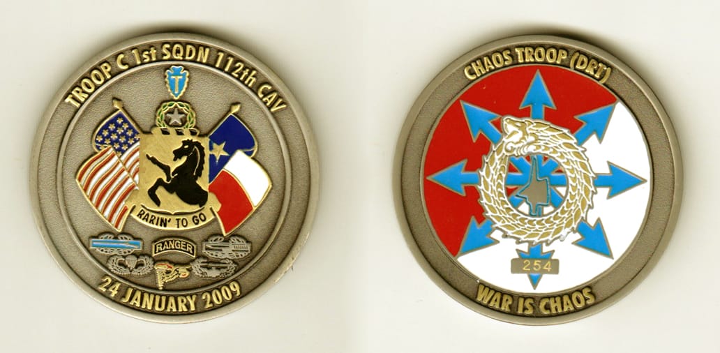 Round shaped, pewter colored coin, 1-3/4 inches in diameter.