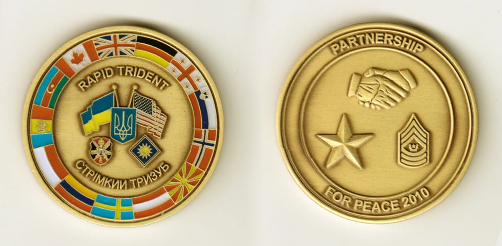 Round shaped, brass colored coin, 1-3/4 inches in diameter.