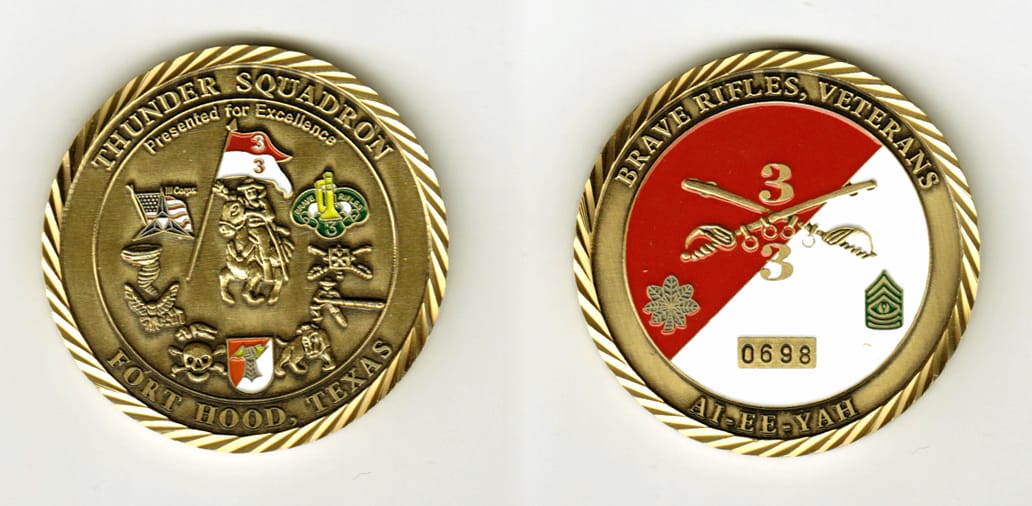 Round shaped, brass colored coin, 2 inches in diameter.