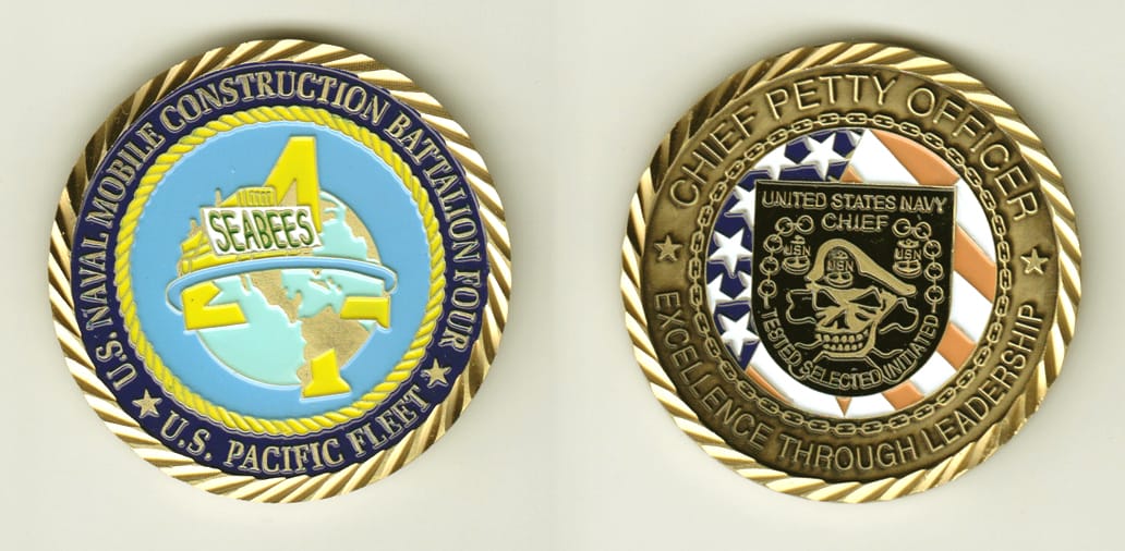 Round shaped, brass colored coin, 2 inches in diameter.