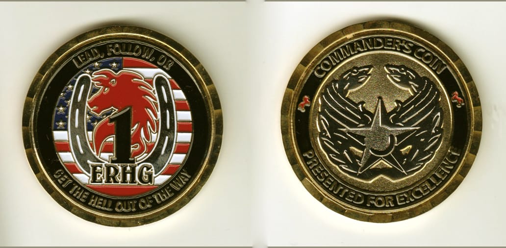 Round shaped, gold colored coin, 2 inches in diameter.