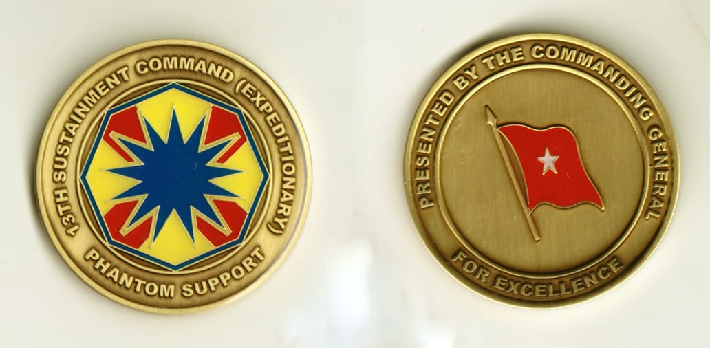 Round shaped, brass colored coin, 2 inches in diameter.