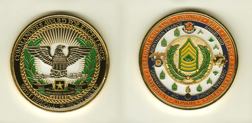 Round shaped, gold colored coin, 2 inches in diameter.