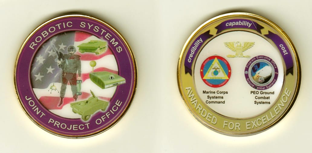 Round shaped, brass colored coin, 2 inches in diameter.