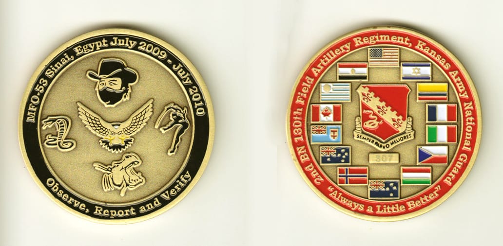 Round shaped, brass colored coin, 2 inches in diameter.