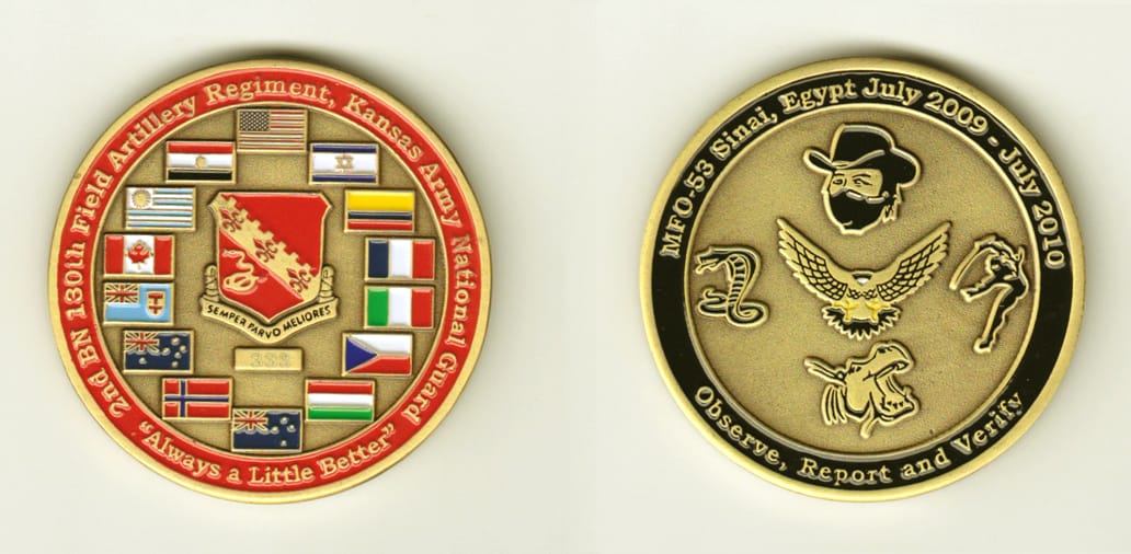 Round shaped, brass colored coin, 2 inches in diameter.