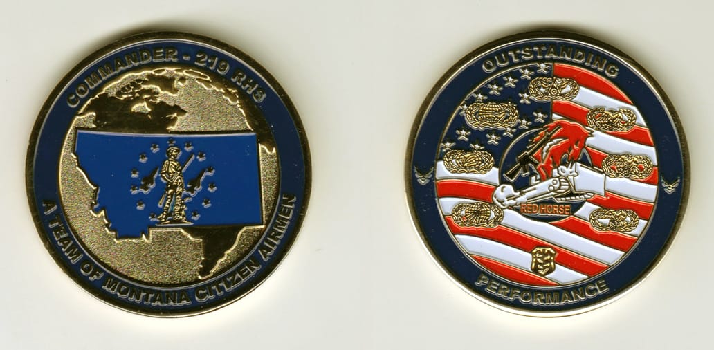 Round shaped, gold colored coin, 2 inches in diameter.