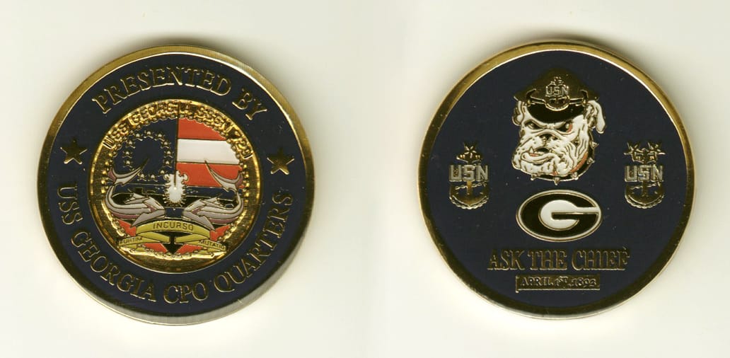 Round shaped, gold colored coin, 1-3/4 inches in diameter.