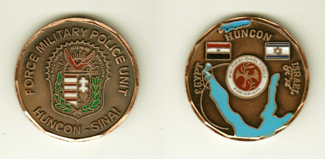 Round shaped, brass colored coin, 1-1/2 inches in diameter.