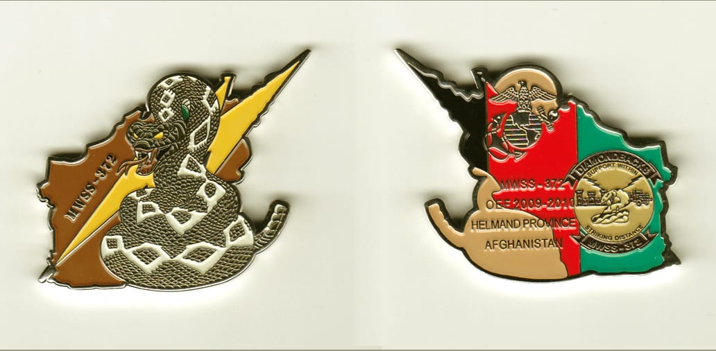 Afghanistan shaped with lightening bolt and coiled snake extending, gold colored coin, 2 inches wide x 1-1/2 inches high...