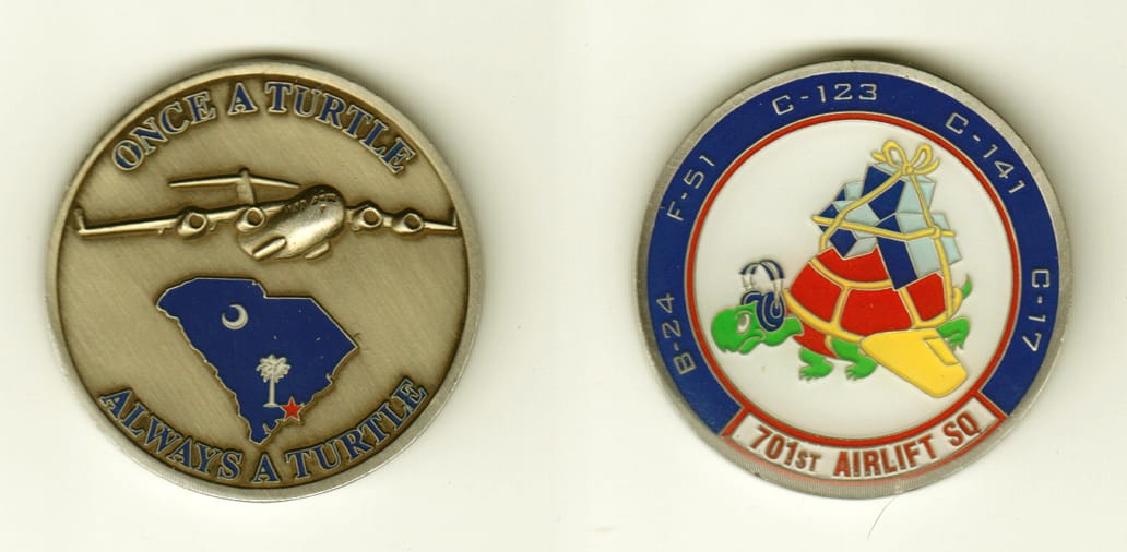 Round shaped, silver colored coin, 1-1/2 inches in diameter.